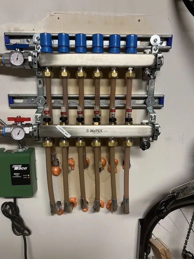 Plumber performing Water Heater Repair at a residential property in Highland Park